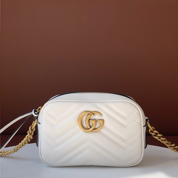 Gucci Handbags - Gucci Cream Crossbody Bag with Gold Details